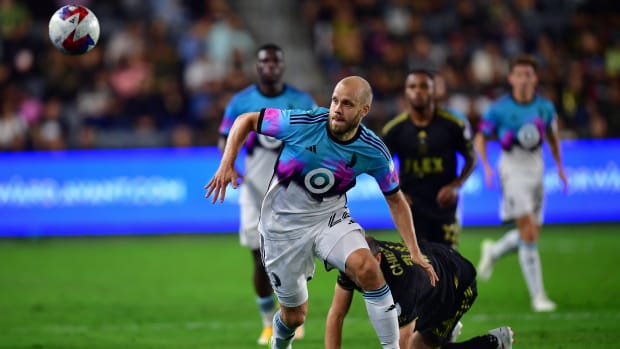 Oct 4, 2023; Los Angeles, California, USA; Minnesota United forward Teemu Pukki (22) plays for the ball against Los Angeles FC defender Giorgio Chiellini (14) during the first half at BMO Stadium.